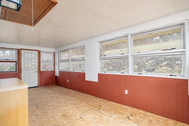 unfurnished sunroom featuring plenty of natural light