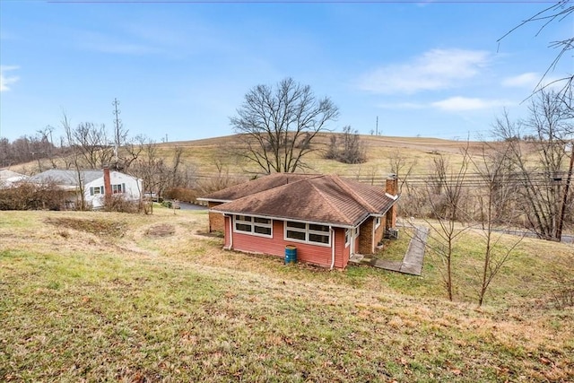 view of yard with a rural view