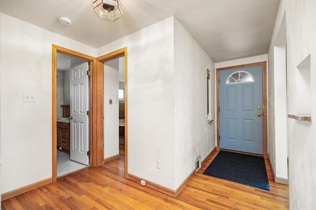 foyer entrance with light wood-type flooring