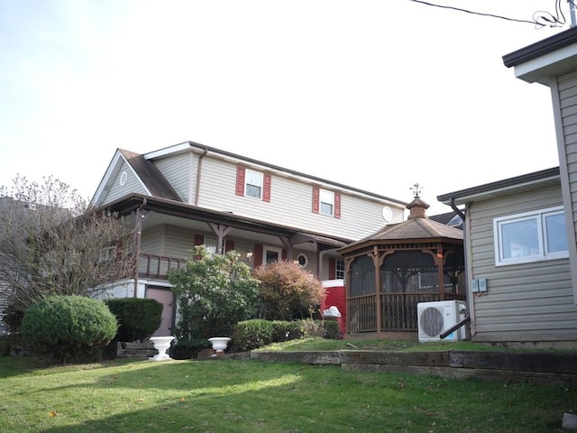 exterior space with a gazebo, ac unit, and a front yard