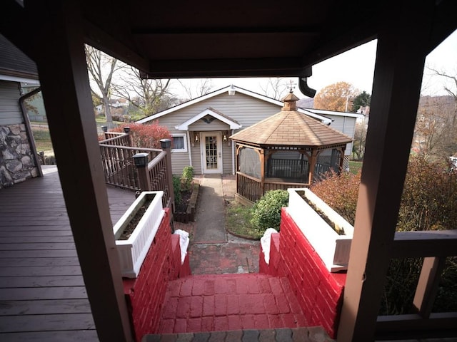 wooden terrace with a gazebo