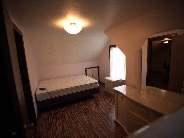 bedroom with lofted ceiling