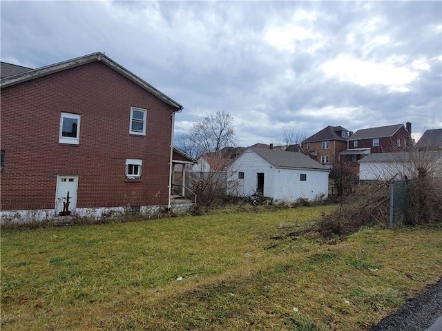 view of side of property with a yard