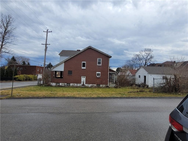 view of home's exterior with a lawn