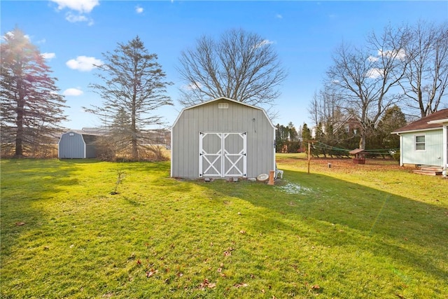 view of outdoor structure with a lawn