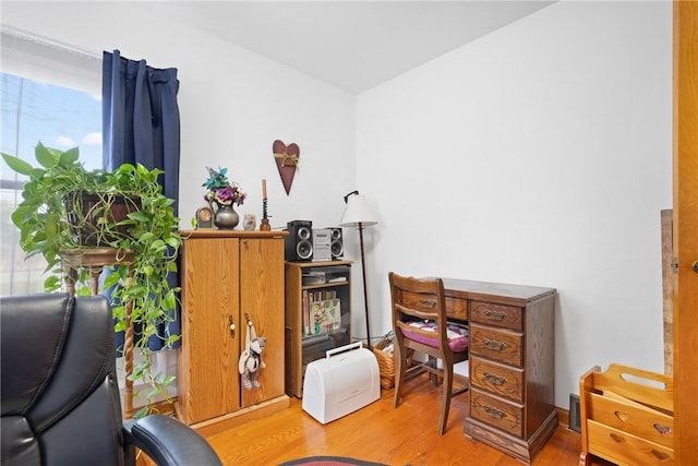 home office with light wood-type flooring