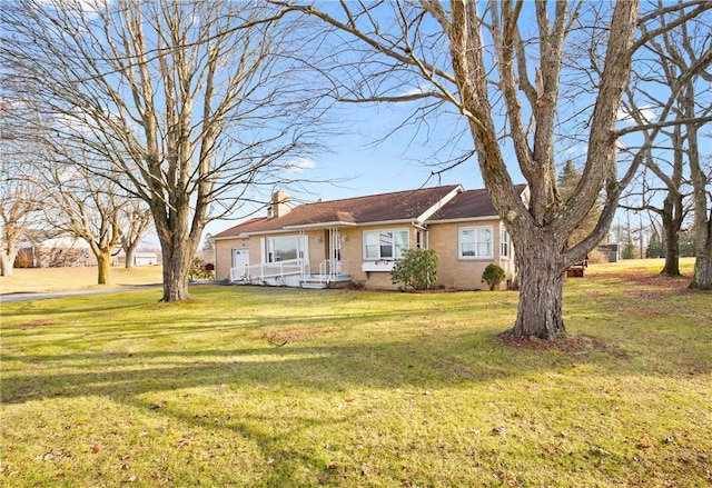 single story home featuring a front lawn and covered porch