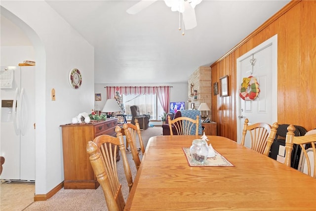 dining room featuring ceiling fan and light colored carpet