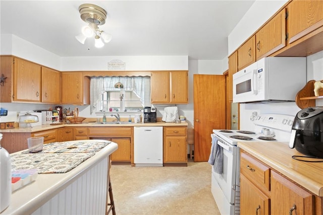 kitchen featuring sink and white appliances