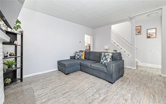 living room with light hardwood / wood-style floors