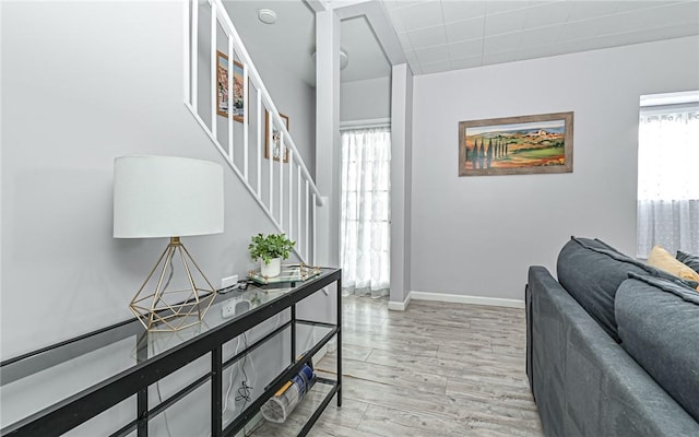 foyer with light hardwood / wood-style floors and a healthy amount of sunlight