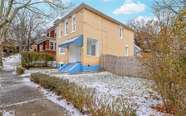 view of snow covered house