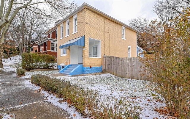 view of snow covered house