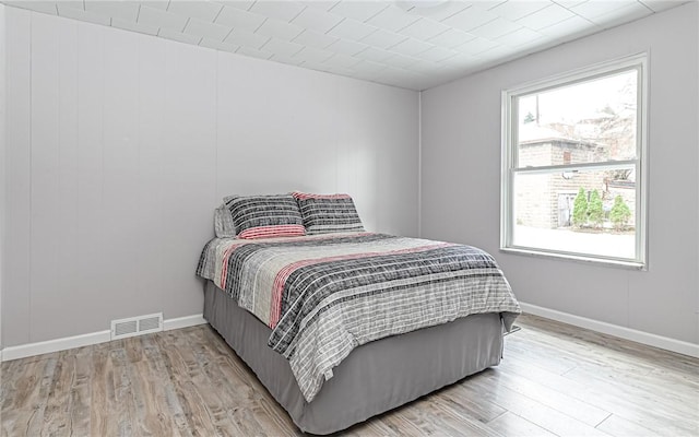 bedroom with light wood-type flooring