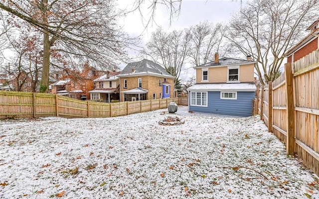 view of yard layered in snow