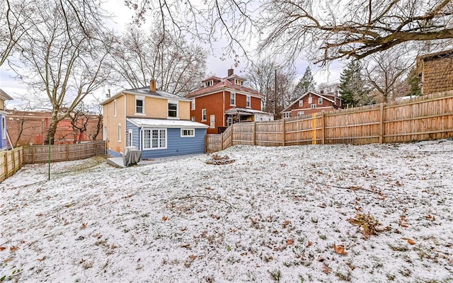 view of snow covered property