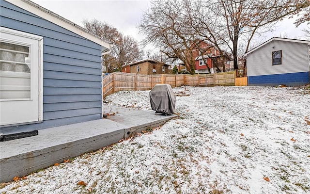 view of yard layered in snow