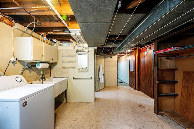 laundry room with washer / clothes dryer and cabinets