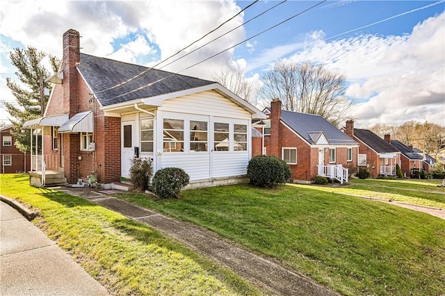 view of side of property with a yard