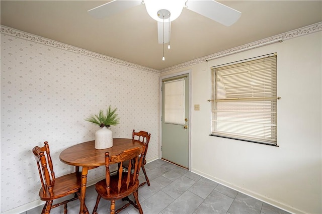 tiled dining room with ceiling fan