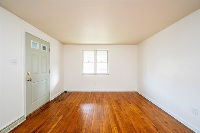 spare room featuring hardwood / wood-style flooring