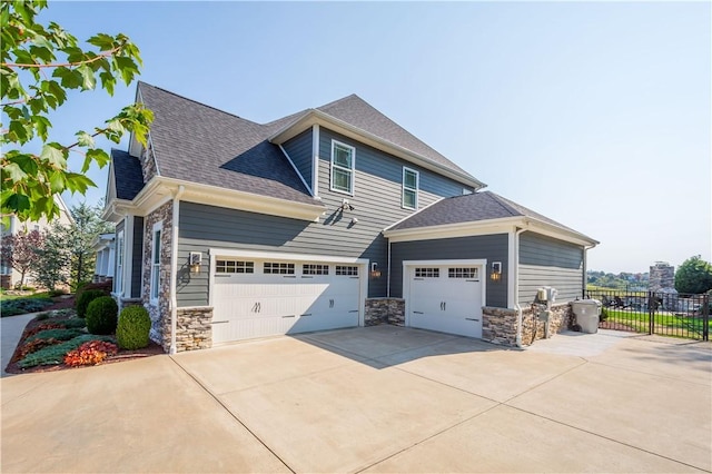 view of side of property with a garage