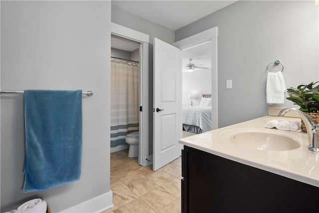 bathroom featuring a shower with curtain, vanity, ceiling fan, tile patterned flooring, and toilet