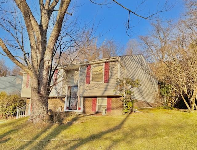 bi-level home with a front yard