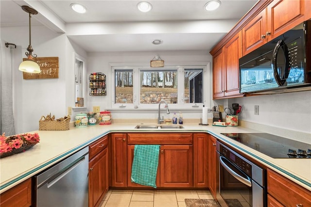 kitchen featuring light tile patterned flooring, pendant lighting, sink, and black appliances