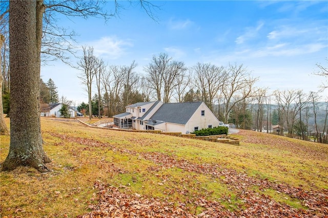 view of property exterior with a lawn