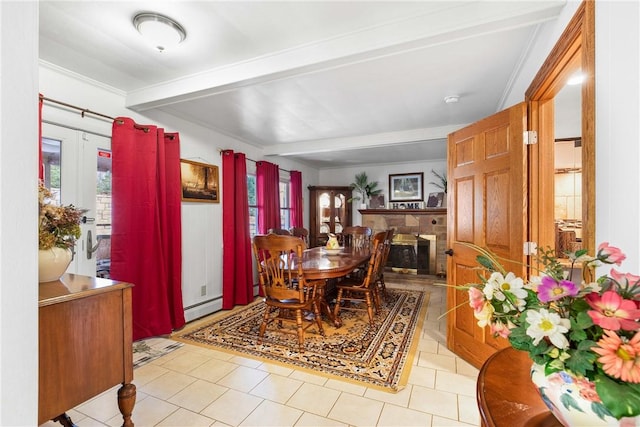 dining area featuring beam ceiling, baseboard heating, a wealth of natural light, and light tile patterned flooring