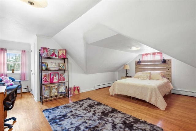 bedroom with baseboard heating, hardwood / wood-style floors, and lofted ceiling