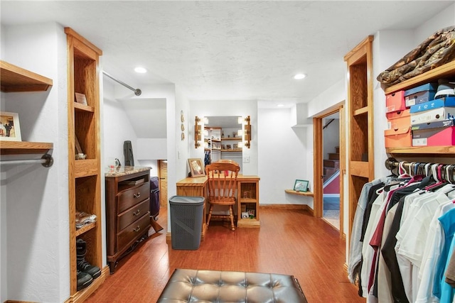 walk in closet featuring hardwood / wood-style floors