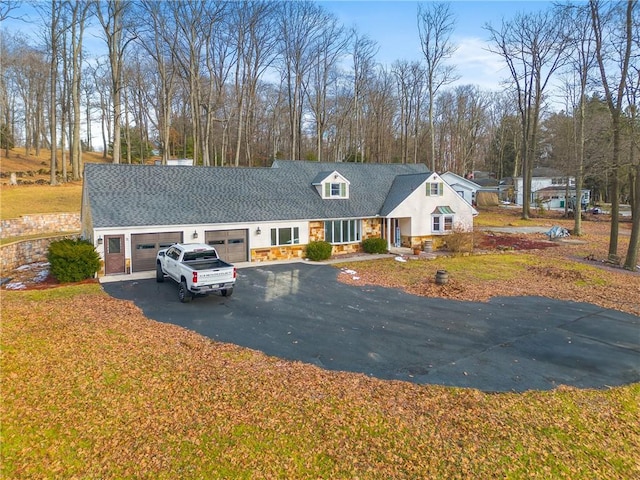 cape cod house with a garage