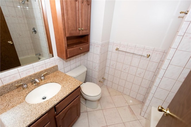 full bathroom with decorative backsplash, tiled shower / bath combo, tile walls, tile patterned flooring, and toilet