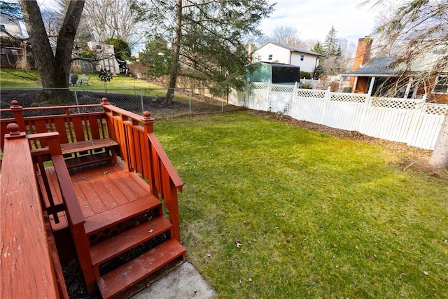 view of yard featuring a deck