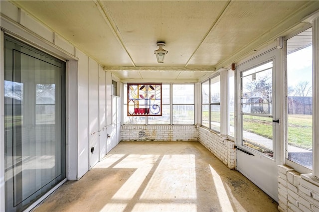 unfurnished sunroom featuring plenty of natural light