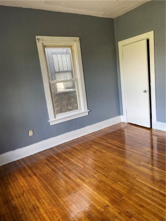 empty room featuring wood-type flooring