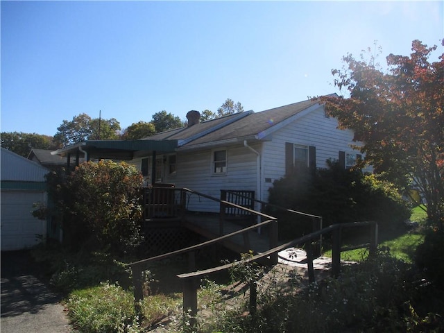 view of home's exterior with a deck