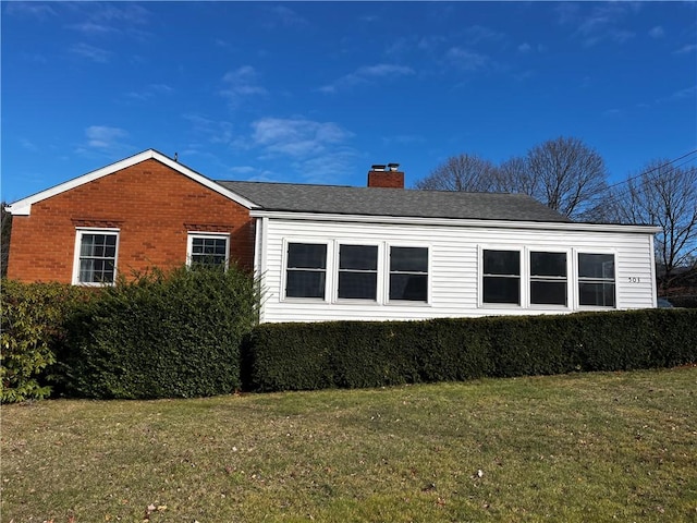 view of home's exterior featuring a yard