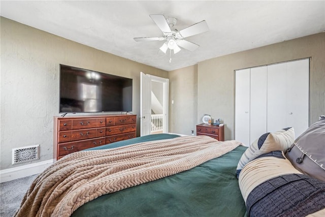 bedroom featuring carpet, a closet, and ceiling fan