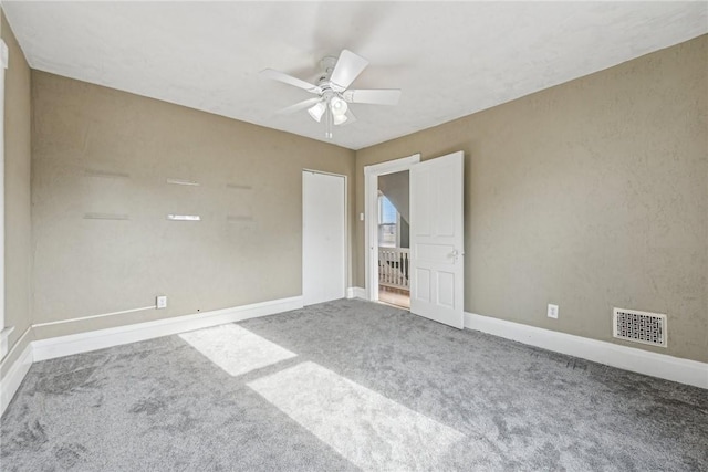 unfurnished bedroom with ceiling fan and carpet floors