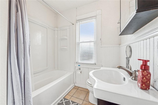 full bathroom featuring shower / bath combo, sink, tile patterned flooring, toilet, and radiator heating unit