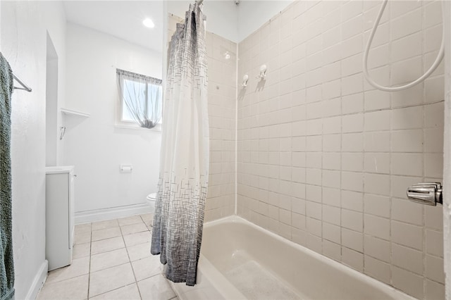 bathroom with tile patterned flooring, shower / bath combination with curtain, and toilet