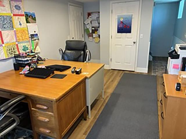 office with hardwood / wood-style flooring