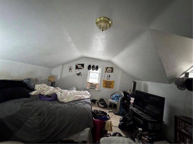 carpeted bedroom with vaulted ceiling