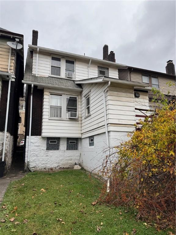 view of property exterior featuring a lawn and cooling unit