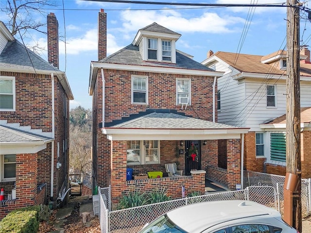 rear view of house with a porch