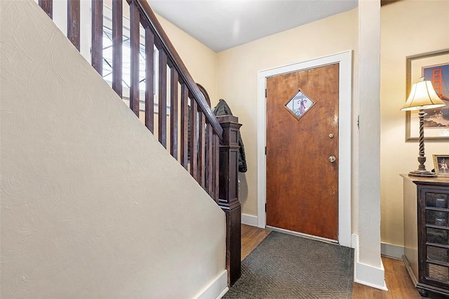 foyer entrance with hardwood / wood-style flooring