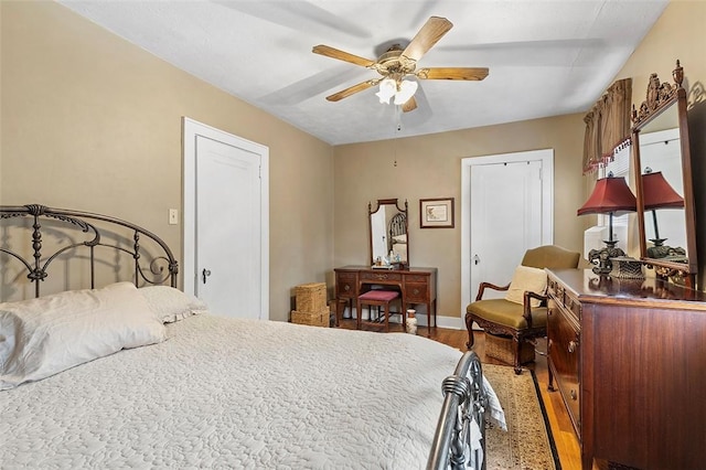 bedroom with wood-type flooring and ceiling fan